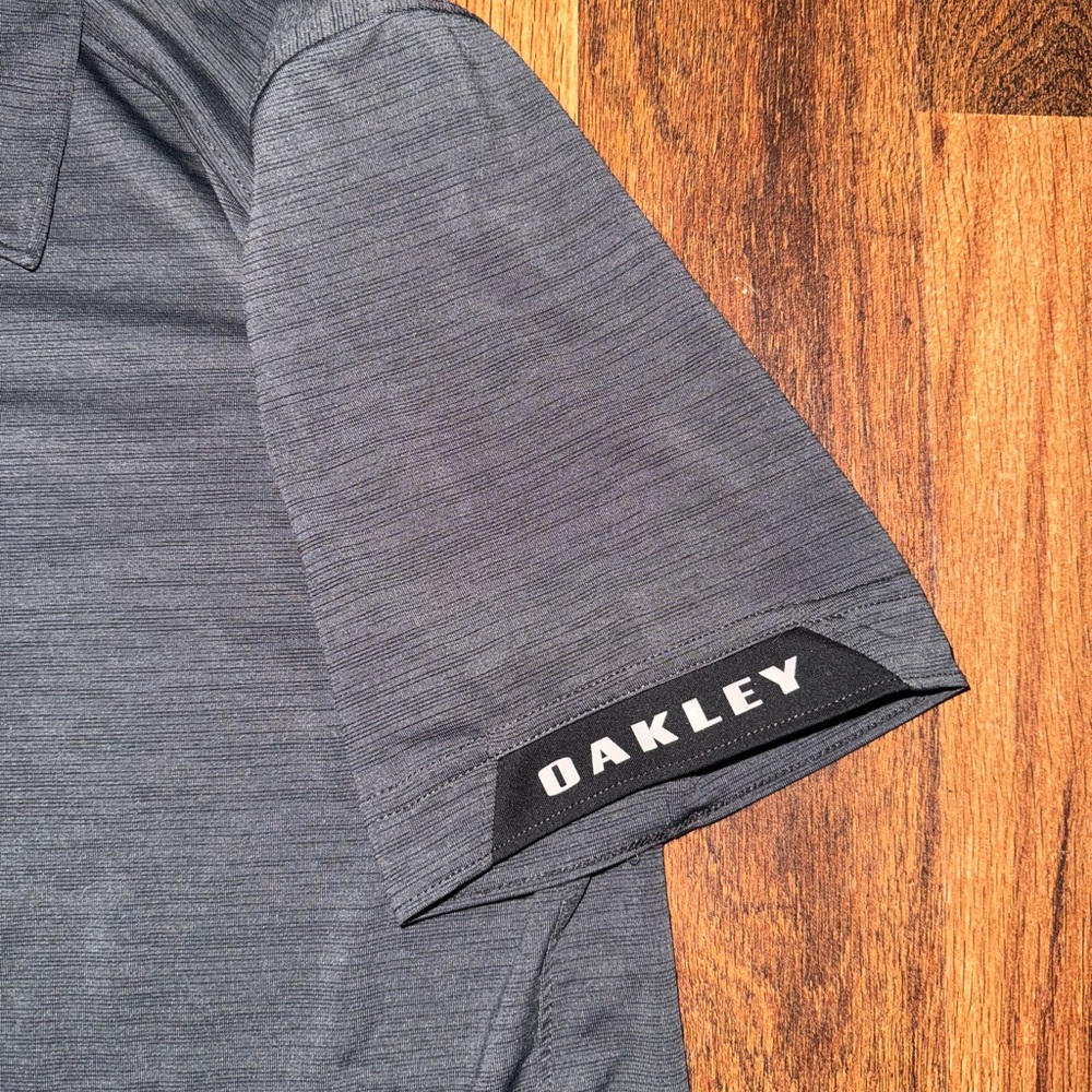 Oakley Black Polo Shirt Sleek Performance Design - Picture 2 of 3